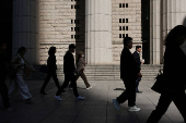 Commuters walk in Shanghai