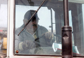 FILE PHOTO: Uruguay presidential candidate Mujica works on his farm after casting his vote during the Uruguayan National elections
