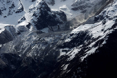 Debris and dust from a crumbling glacier that partially collapsed and tumbled onto the village of Blatten