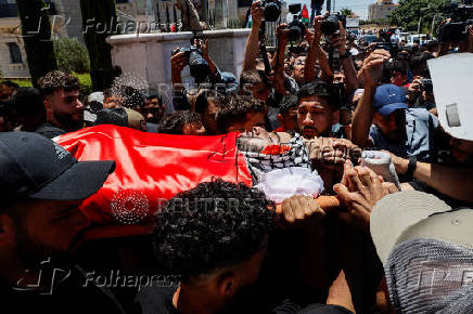 Mourners take part in the funeral of of Sayfollah Kamel Musallet, killed amid the Israel-Gaza conflict, near Ramallah