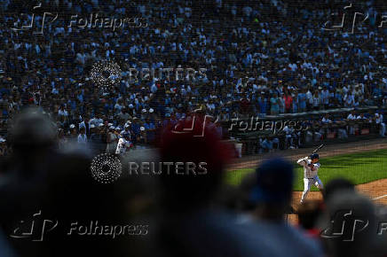 Baseball fans watch Chicago Cubs and the Milwaukee Brewers at Wrigley Field in Chicago