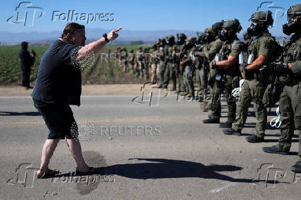 U.S. federal agents and immigration officers raid an agricultural facility in Camarillo