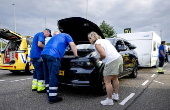 Vacationers have their vehicles checked at the border crossing with Belgium