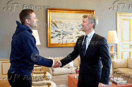 Denmarks King Frederik greets Greenland's new Prime Minister Jens-Frederik Nielsen at Amalienborg Palace in Copenhagen