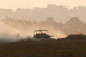 FILE PHOTO: An Israeli tank manoeuvres in Gaza