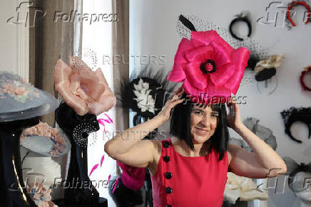 Milliner Merve Bayindir wears one of her hat creations as she speaks to Reuters ahead of the Ascot horse racing festival, in London