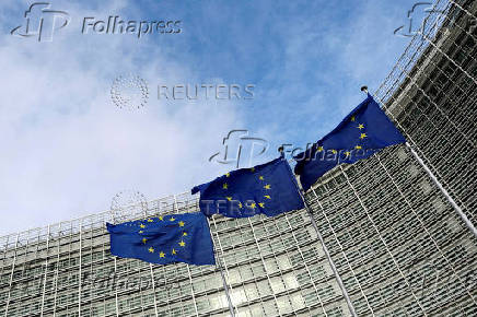 FILE PHOTO: FILE PHOTO: EU flags fly outside the European Commission in Brussels