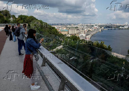 People look at the Ukrainian capital Kyiv