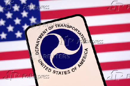 FILE PHOTO: Illustration shows United States Department of Transportation logo and U.S. flag