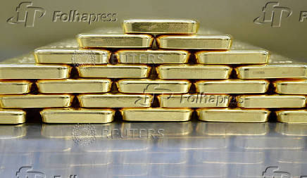 FILE PHOTO: Gold bars and coins in the safe at Pro Aurum gold house in Munich