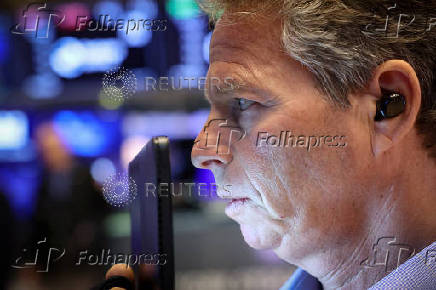 Traders work on the floor of the NYSE in New York