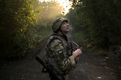 A Ukrainian serviceman is seen at a position on a front line near the city of Kostiantynivka