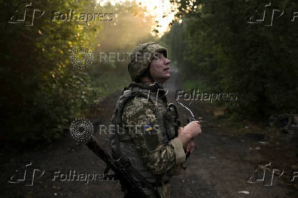 A Ukrainian serviceman is seen at a position on a front line near the city of Kostiantynivka