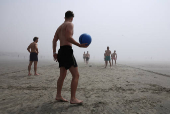 People enjoy the beach in West Wittering
