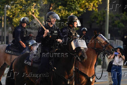 Protests against federal immigration sweeps continue in Los Angeles