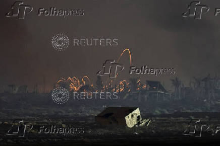 An explosion in Gaza is seen from the Israeli side of the Israel-Gaza border