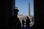 Carabinieri members stand in St. Peter's Square ahead of the conclave which will be held on May 7, at the Vatican