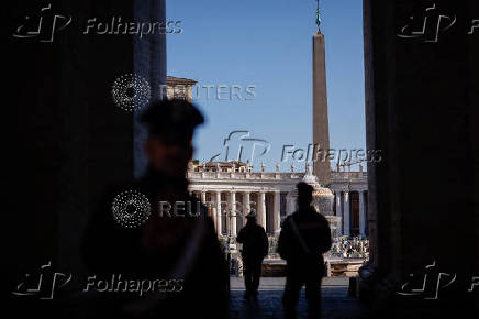 Carabinieri members stand in St. Peter's Square ahead of the conclave which will be held on May 7, at the Vatican