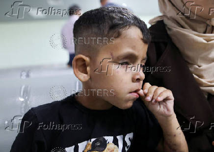A Palestinian boy in need of medical treatment arrives at King Hussein Bridge crossing, in South Shuna