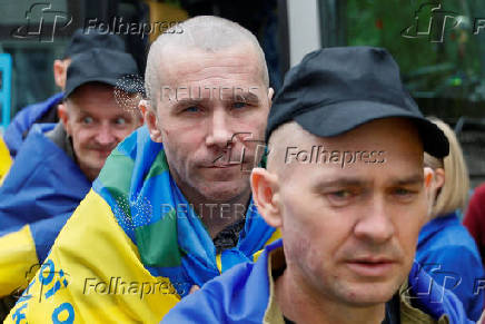 Freed Ukrainian POWs return after a swap in an undisclosed location in Ukraine