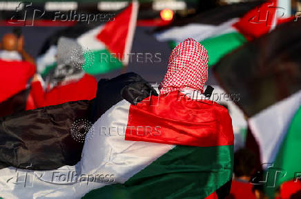 Pro-Palestinian protesters demonstrate on the Zuiderstrand beach against the violence in Gaza