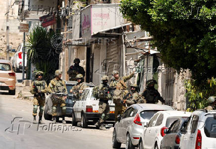 Israeli soldiers take part in a Israeli raid in Nablus