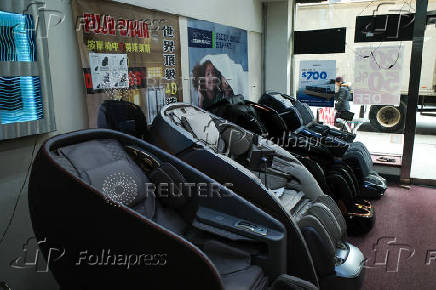 Massage chairs, imported from China, are displayed for sale at a furniture store in the Chinatown neighborhood of Manhattan in New York City