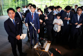 Japan's incoming Agriculture, Forestry and Fisheries Minister Shinjiro Koizumi speaks to media in Tokyo
