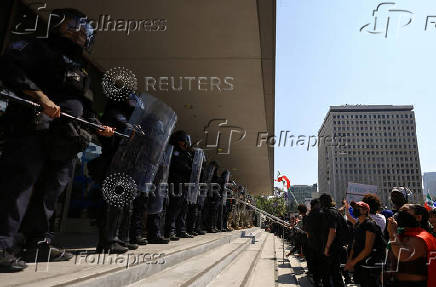 FILE PHOTO: California National Guard troops stand outside the Edward R. Roybal Federal Building, in Los Angeles