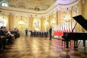 Polish President-elect Karol Nawrocki receives the winning certificate