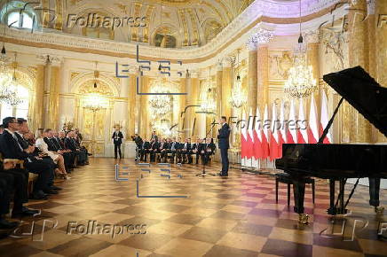 Polish President-elect Karol Nawrocki receives the winning certificate