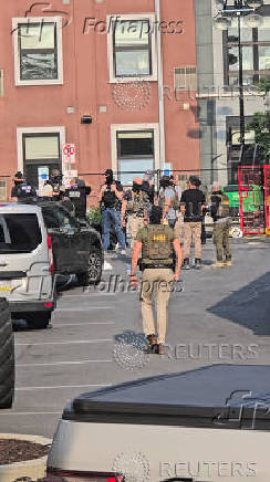 Law enforcement officers conduct a federal immigration raid in Bethlehem