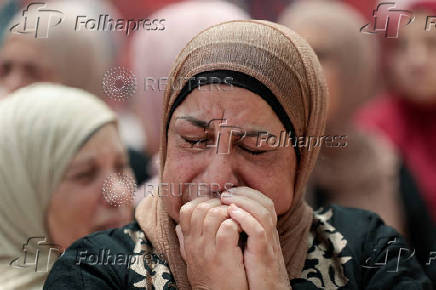 Mourners take part in the funeral of Mohammad Al-Shalabi, near Ramallah