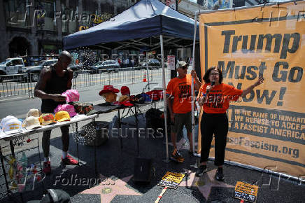 Protesters denounce U.S. President Trump for threatening to strip comedian Rosie O?Donnell of her citizenship, in Los Angeles, California