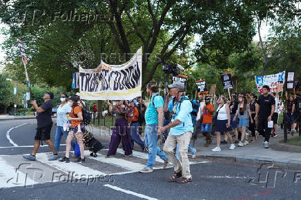 People protest after U.S. President Trump announced he would deploy the National Guard to the nation's capital and place D.C.'s Metropolitan Police Department under federal control, in Washington