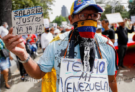 People march in demand of better salaries, in Caracas