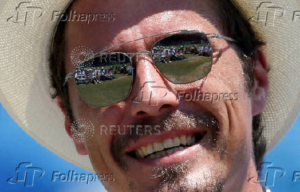 FILE PHOTO: The sunglasses of Safin of Russia reflect the crowd on Centre Court during his induction ceremony the International Tennis Hall of Fame in Newport