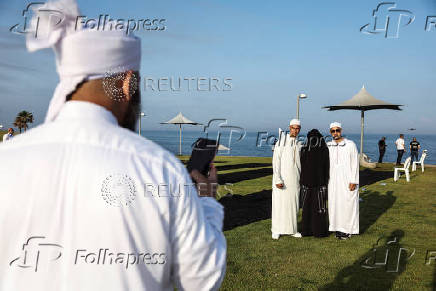 Israeli Muslims pray on the first day of the Muslim holiday of Eid al-Adha by the sea side of the Mediterranean, in Jaffa