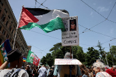 Pro-Palestinian protesters attend a demonstration calling for an end to the bombing in Gaza, in Rome