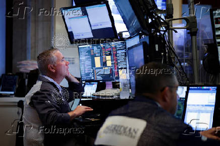 A trader works on the floor at the New York Stock Exchange (NYSE) in New York City