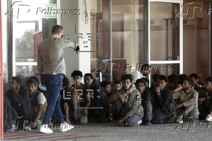 Rescued migrants are transferred from Crete to the port city of Lavrio