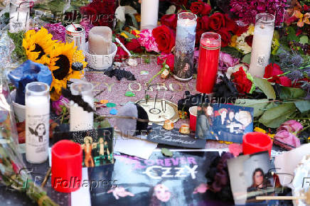 Flowers and pictures are placed on the star of late Ozzy Osbourne at the Hollywood Walk of Fame in Los Angeles