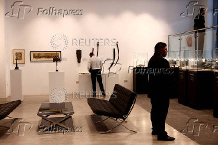 Security personnel stand guard with from Sotheby's