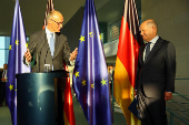 German Chancellor Olaf Scholz hands over to his successor Friedrich Merz