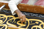 Workers prepare the Kiswa, a silk cloth that covers the Kaaba, ahead of the annual hajj pilgrimage