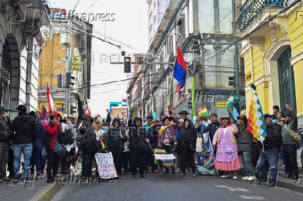 Evo Morales supporters march in mourning amid economic crisis, in La Paz