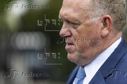 White House border czar Tom Homan talks with news media outside the White House