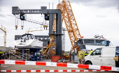 Tower crane falls on workboat in Maasbracht, Netherlands