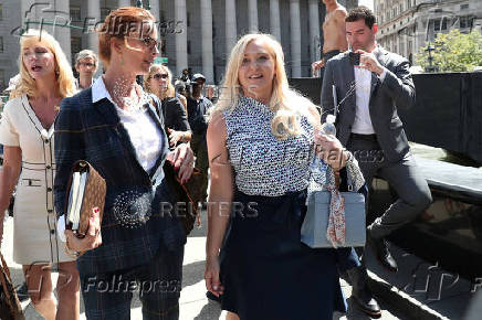 FILE PHOTO: Giuffre, an alleged victim of Epstein, walks after the hearing in the criminal case against him at Federal Court in New York