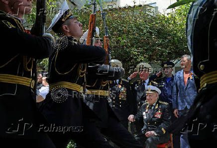 World War Two veteran Nikolai Golubtsov receives congratulations on the upcoming Victory Day in Sevastopol